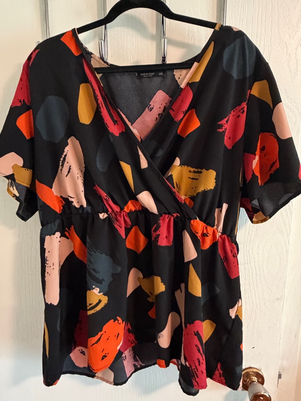 Women's Black Abstract Print Surplice Peplum Top